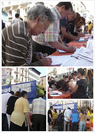 '圖2：薩拉戈薩市民和遊客們紛紛簽名聲援法輪功反迫害'