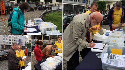 布魯塞爾歐洲議會大樓前，人們紛紛簽名支持法輪功反迫害
