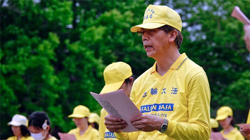 '圖4：劉明輝參加二零二零年五月二日龍潭石管局大草坪的慶祝活動。'