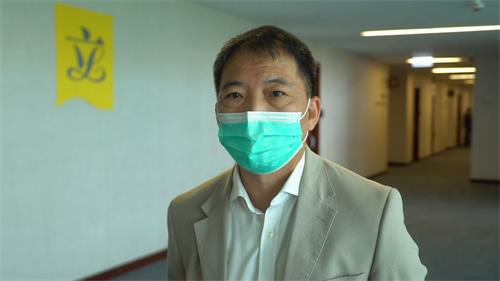 '圖9：民主黨主席、立法會議員胡志偉'