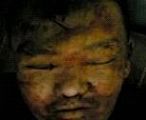 曾在泰來監獄冰櫃裏的傷痕累累的劉晶明遺體。