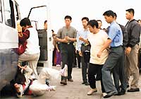 '這是我在天安門被推倒在地上的照片，照片登在明慧網10月2日的媒體新聞中。'