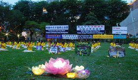 Ɖ，新加坡法輪功學員在芳林公園燭光悼念被中共迫害致死的大陸同修'