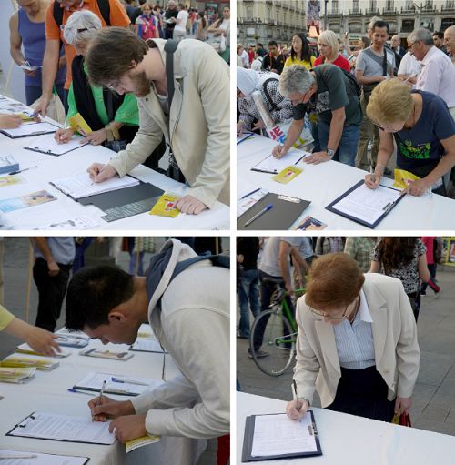 各國民眾在馬德裏市中心太陽廣場上簽名支持反迫害