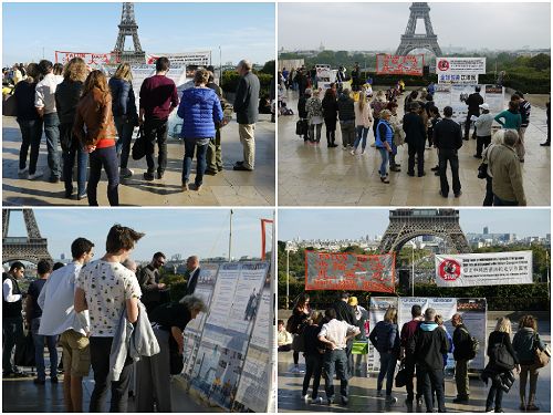 圖1：法輪功學員在巴黎人權廣場講真相，人們圍著法輪功的信息台了解真相