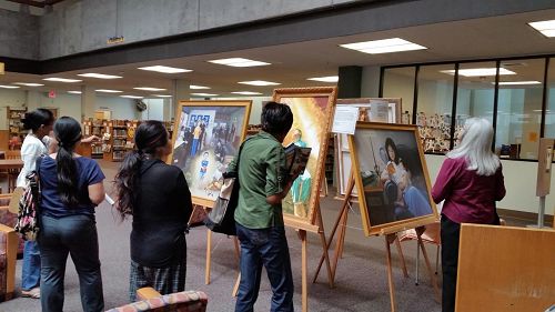 '圖1-2：舊金山灣區Vallejo市中心的甘迺迪圖書館內，舉辦了為期一個月的真善忍國際畫展'