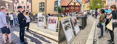 '圖3：來參加瑞典榆樹谷公園週的人們正在仔細閱讀展板，了解法輪功真相。'