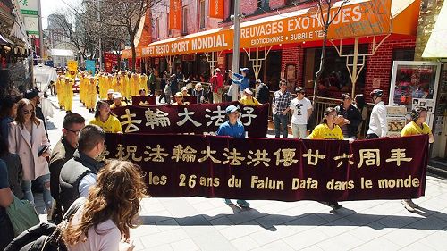 圖6：二零一八年五月五日，蒙特利爾法輪大法日慶祝遊行隊伍走過唐人街。