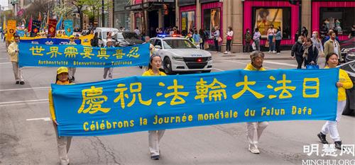 '圖2～11：5月8日，加拿大魁北克部份法輪功學員在蒙特利爾舉行盛大遊行活動，慶祝世界法輪大法日。'
