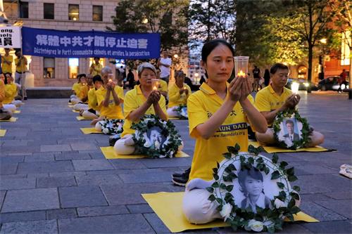 '圖5：法輪功學員韓女士參加燭光悼念活動'